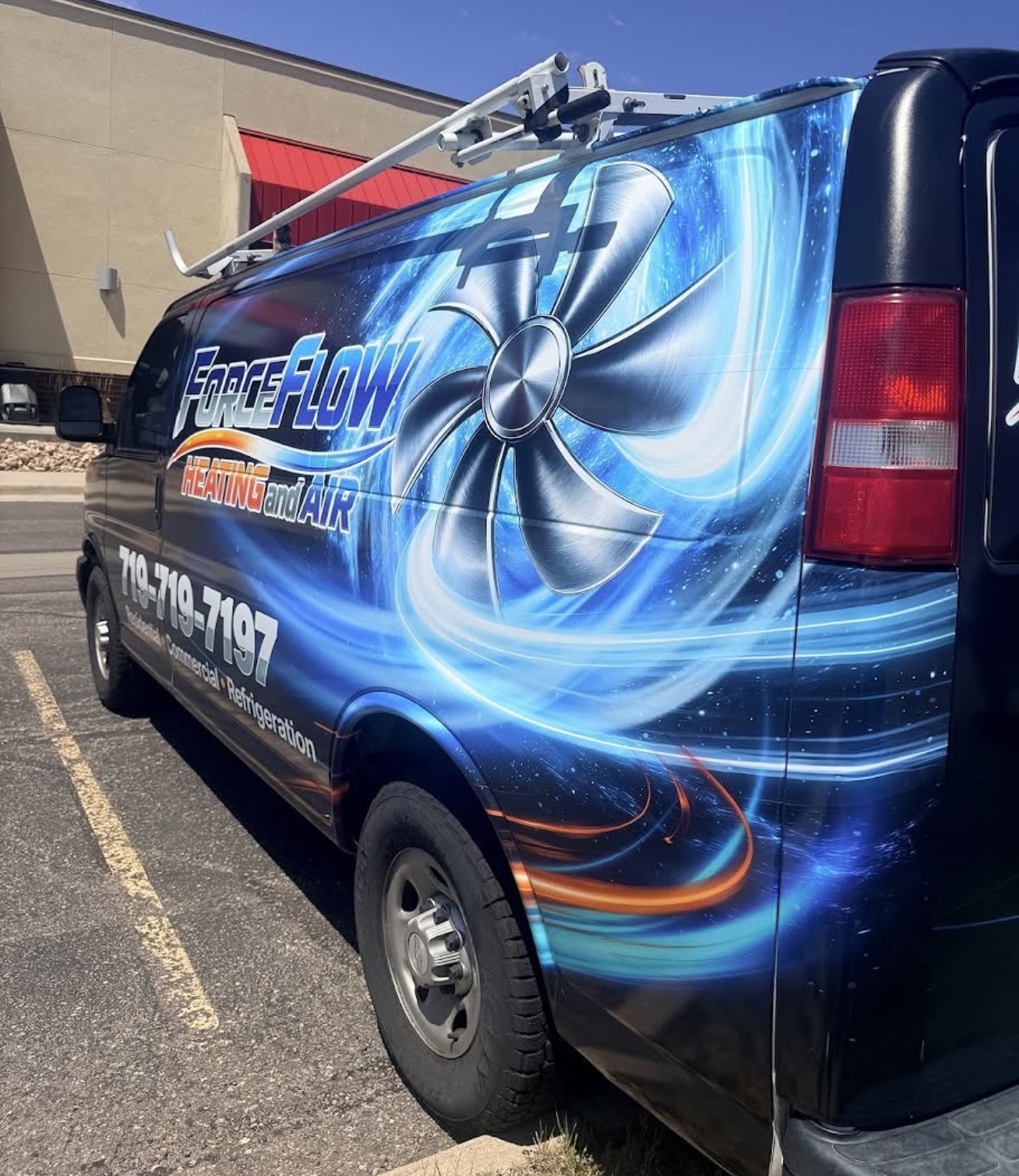 ForceFlow Heating and Air cargo van wrapped with full-color printed graphics